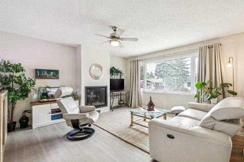 731 Archwood Road Se, Calgary, AB - Indoor Photo Showing Living Room With Fireplace