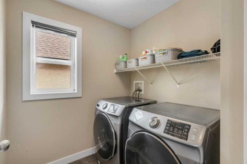 360 Marquis Heights Se, Calgary, AB - Indoor Photo Showing Laundry Room