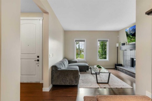 360 Marquis Heights Se, Calgary, AB - Indoor Photo Showing Living Room With Fireplace