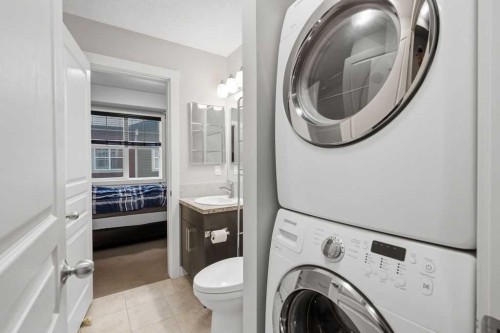 218 Cranford Se, Calgary, AB - Indoor Photo Showing Laundry Room