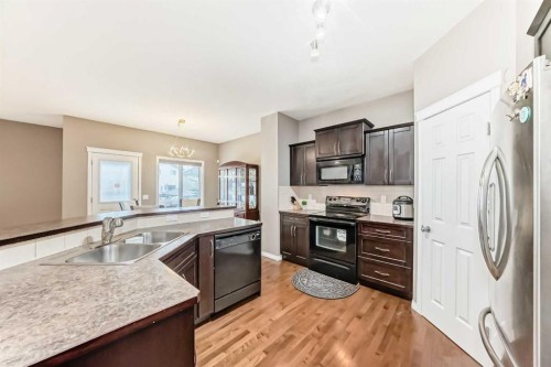 2092 Reunion Boulevard Nw, Airdrie, AB - Indoor Photo Showing Kitchen With Double Sink