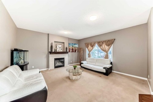 2092 Reunion Boulevard Nw, Airdrie, AB - Indoor Photo Showing Living Room With Fireplace