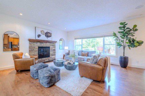 1835 Evergreen Drive Sw, Calgary, AB - Indoor Photo Showing Living Room With Fireplace