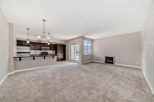 206-488 7 Avenue Ne, Calgary, AB - Indoor With Fireplace