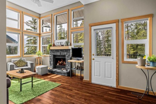 13-242 Benchlands Terrace, Canmore, AB - Indoor With Fireplace