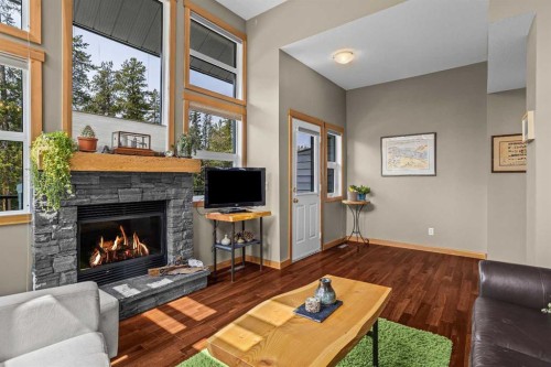 13-242 Benchlands Terrace, Canmore, AB - Indoor Photo Showing Living Room With Fireplace