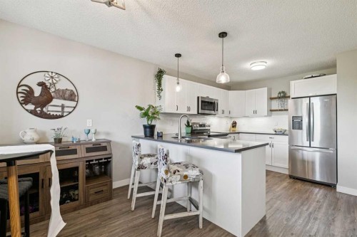 110S-203 Lynnview Road Se, Calgary, AB - Indoor Photo Showing Kitchen With Stainless Steel Kitchen With Upgraded Kitchen