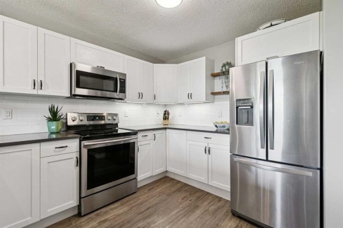 110S-203 Lynnview Road Se, Calgary, AB - Indoor Photo Showing Kitchen With Stainless Steel Kitchen With Upgraded Kitchen