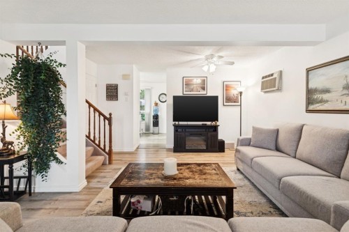 283 Abinger Crescent Ne, Calgary, AB - Indoor Photo Showing Living Room