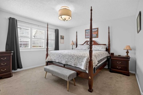 121 Rockyspring Terrace Nw, Calgary, AB - Indoor Photo Showing Bedroom