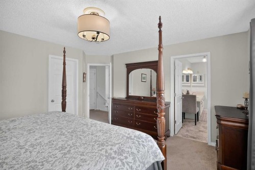 121 Rockyspring Terrace Nw, Calgary, AB - Indoor Photo Showing Bedroom