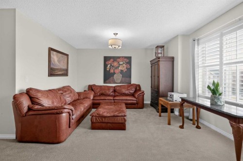 121 Rockyspring Terrace Nw, Calgary, AB - Indoor Photo Showing Living Room