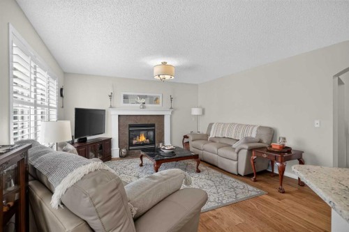 121 Rockyspring Terrace Nw, Calgary, AB - Indoor Photo Showing Living Room With Fireplace