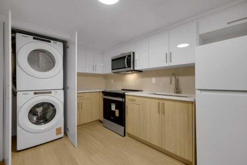 20 Bernard Way Nw, Calgary, AB - Indoor Photo Showing Laundry Room