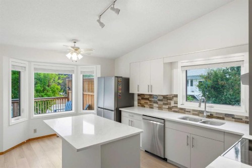5 Sandpiper Gate Nw, Calgary, AB - Indoor Photo Showing Kitchen With Double Sink