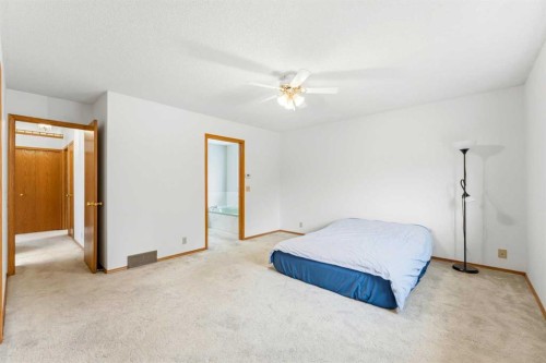 5 Sandpiper Gate Nw, Calgary, AB - Indoor Photo Showing Bedroom