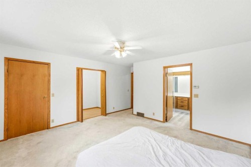 5 Sandpiper Gate Nw, Calgary, AB - Indoor Photo Showing Bedroom