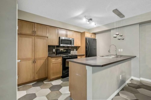 2-21 Mckenzie Towne Gate Se, Calgary, AB - Indoor Photo Showing Kitchen