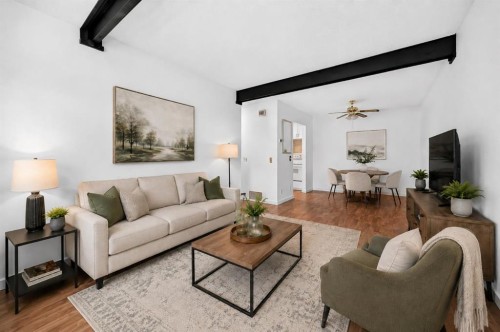 403-11010 Bonaventure Drive Se, Calgary, AB - Indoor Photo Showing Living Room