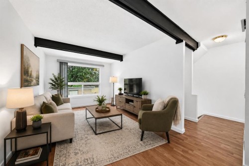 403-11010 Bonaventure Drive Se, Calgary, AB - Indoor Photo Showing Living Room