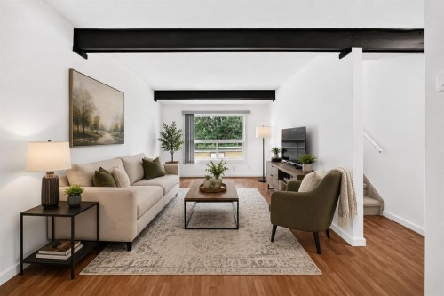403-11010 Bonaventure Drive Se, Calgary, AB - Indoor Photo Showing Living Room