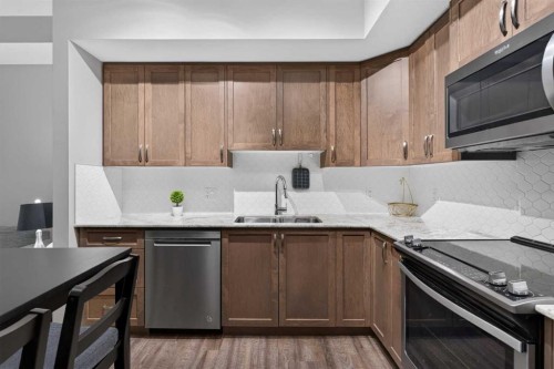 2115-3727 Sage Hill Drive Nw, Calgary, AB - Indoor Photo Showing Kitchen With Stainless Steel Kitchen