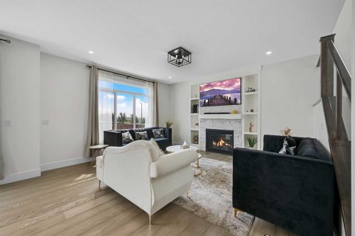 70 South Shore Bay, Chestermere, AB - Indoor Photo Showing Living Room With Fireplace
