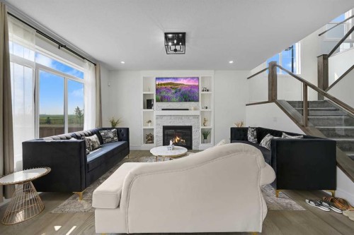 70 South Shore Bay, Chestermere, AB - Indoor Photo Showing Living Room With Fireplace