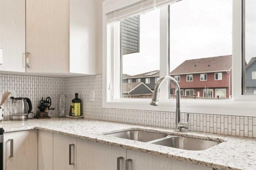 848 Chinook Gate Parade Sw, Airdrie, AB - Indoor Photo Showing Kitchen With Double Sink With Upgraded Kitchen
