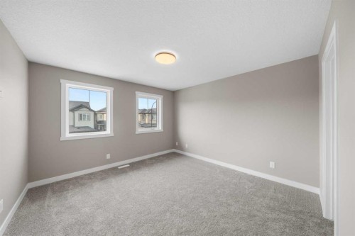94 Sora Gardens Se, Calgary, AB - Indoor Photo Showing Other Room