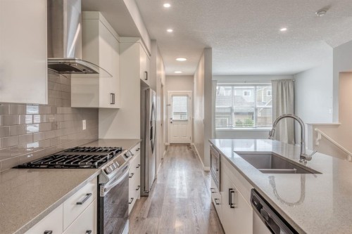 967 Mahogany Boulevard Se, Calgary, AB - Indoor Photo Showing Kitchen With Double Sink With Upgraded Kitchen