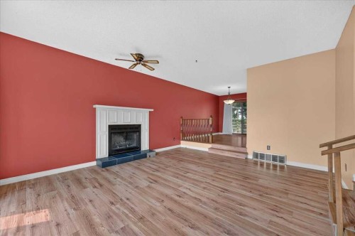 714 9 Avenue Se, High River, AB - Indoor Photo Showing Living Room With Fireplace