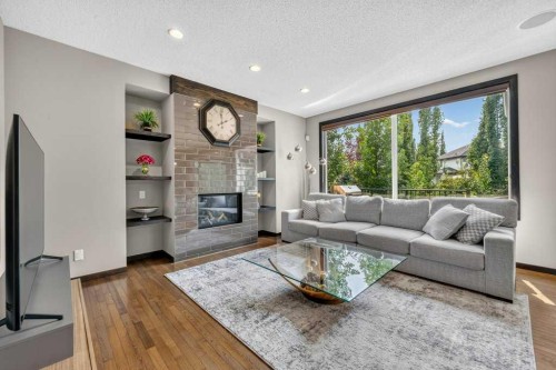 23 Cranarch Landing Se, Calgary, AB - Indoor Photo Showing Living Room With Fireplace