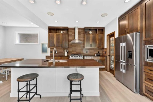 4 Quarry Landing Se, Calgary, AB - Indoor Photo Showing Kitchen With Stainless Steel Kitchen With Double Sink With Upgraded Kitchen