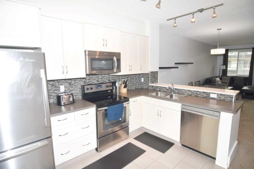 43 Kinlea Common Nw, Calgary, AB - Indoor Photo Showing Kitchen With Stainless Steel Kitchen With Double Sink