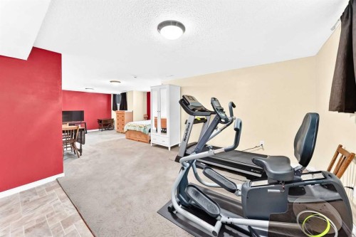 325 Luxstone Green Sw, Airdrie, AB - Indoor Photo Showing Gym Room