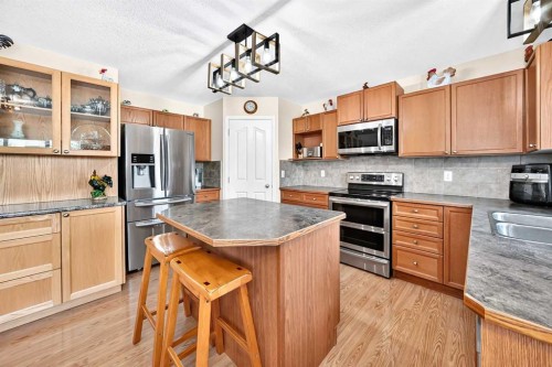325 Luxstone Green Sw, Airdrie, AB - Indoor Photo Showing Kitchen With Stainless Steel Kitchen With Double Sink
