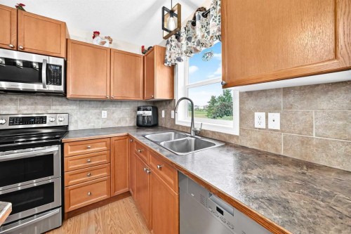 325 Luxstone Green Sw, Airdrie, AB - Indoor Photo Showing Kitchen With Double Sink