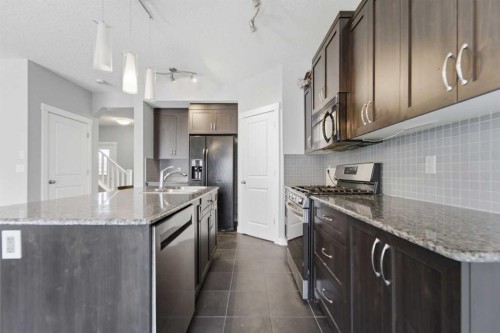 174 Morningside Circle Sw, Airdrie, AB - Indoor Photo Showing Kitchen With Upgraded Kitchen