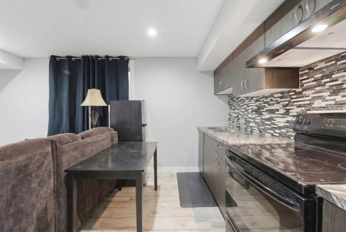 174 Morningside Circle Sw, Airdrie, AB - Indoor Photo Showing Kitchen With Upgraded Kitchen