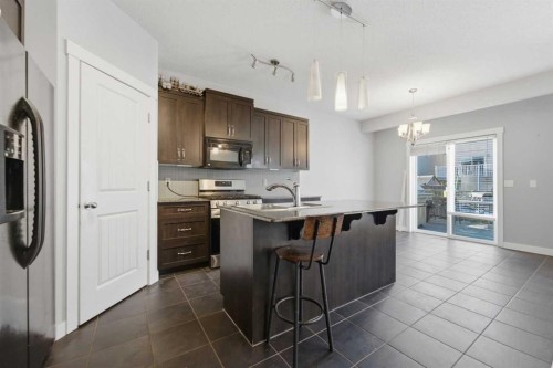 174 Morningside Circle Sw, Airdrie, AB - Indoor Photo Showing Kitchen