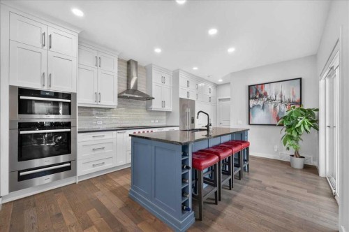 9 Drake Landing Square, Okotoks, AB - Indoor Photo Showing Kitchen With Upgraded Kitchen