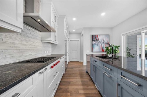 9 Drake Landing Square, Okotoks, AB - Indoor Photo Showing Kitchen With Double Sink With Upgraded Kitchen