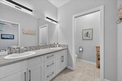 9 Drake Landing Square, Okotoks, AB - Indoor Photo Showing Bathroom