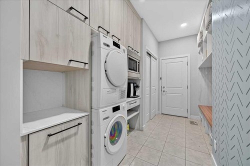 9 Drake Landing Square, Okotoks, AB - Indoor Photo Showing Laundry Room