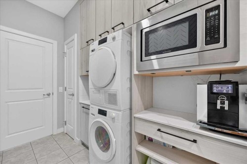 9 Drake Landing Square, Okotoks, AB - Indoor Photo Showing Laundry Room