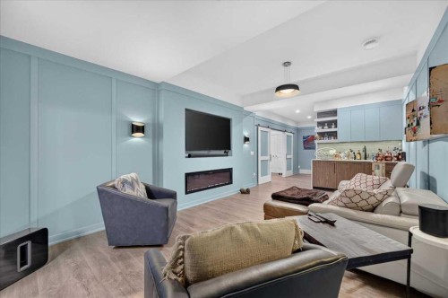9 Drake Landing Square, Okotoks, AB - Indoor Photo Showing Living Room With Fireplace