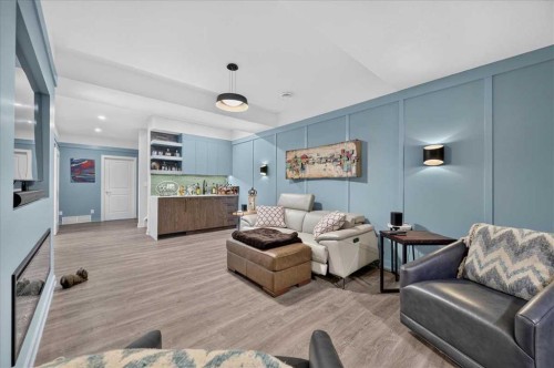 9 Drake Landing Square, Okotoks, AB - Indoor Photo Showing Living Room