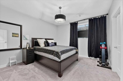9 Drake Landing Square, Okotoks, AB - Indoor Photo Showing Bedroom