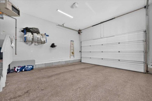 9 Drake Landing Square, Okotoks, AB - Indoor Photo Showing Garage